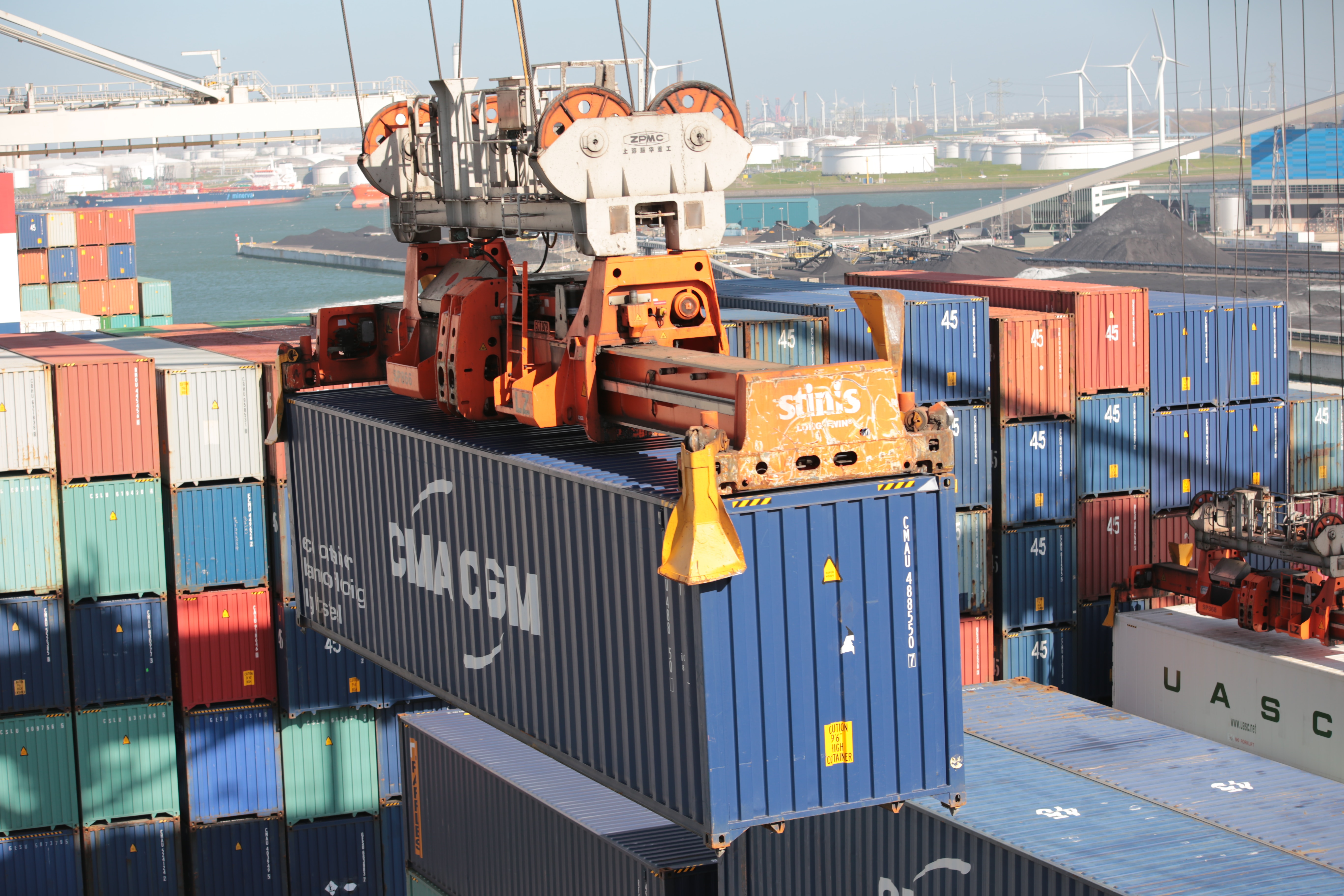 A shipping container lifted through the air.